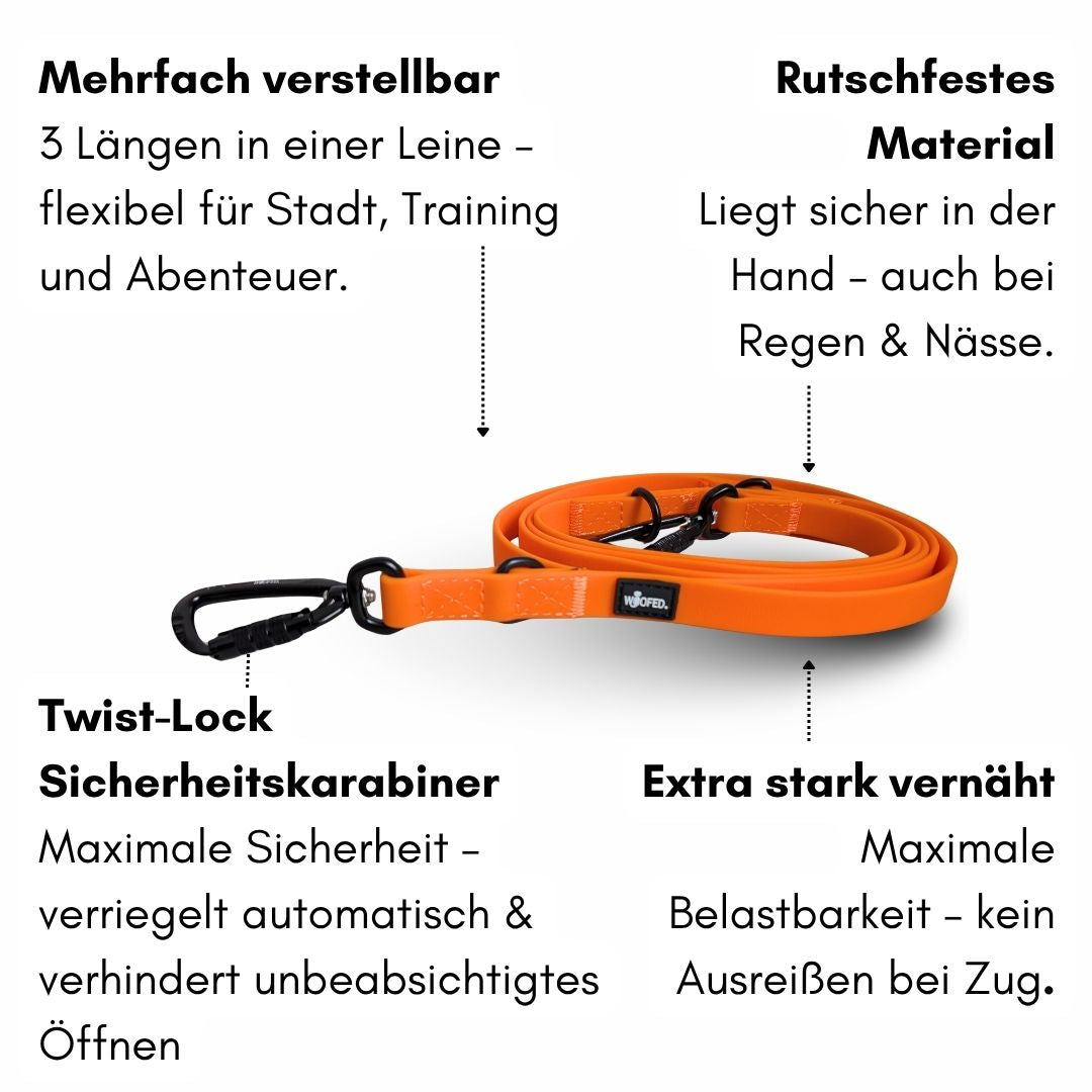 WOOFLEX Führleine Sunset Orange, flach aufgerollt mit schwarzem Twist‑Lock‑Karabiner und verstärkten Nähten