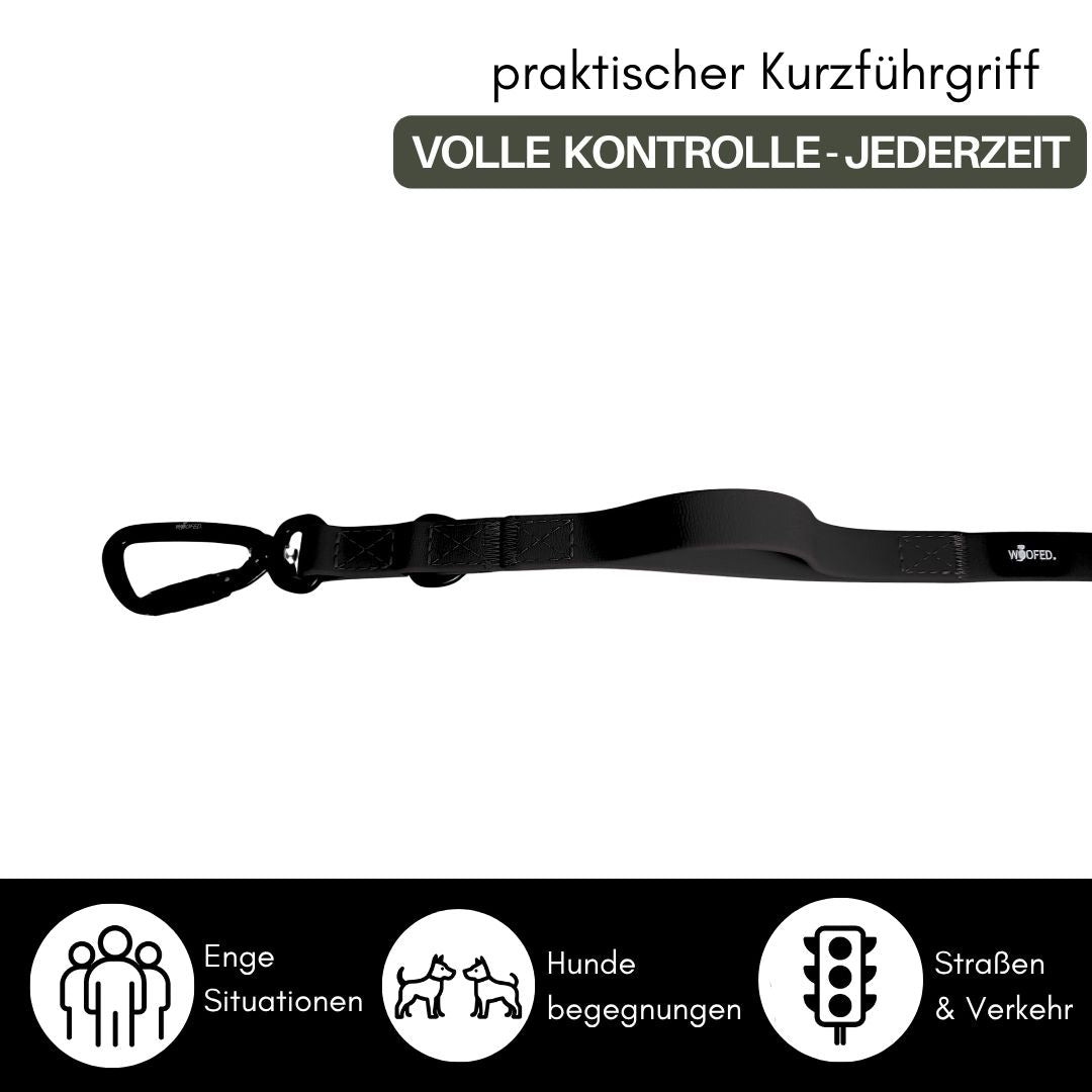 Schwarze WOOFLEX Führleine mit Kurzführgriff und Twist-Lock-Karabiner, seitliche Ansicht auf weißem Hintergrund