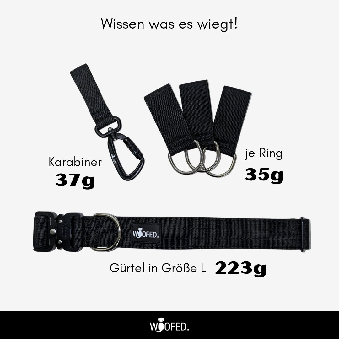 Schwarzer verstellbarer Gassigürtel mit Karabiner, drei D-Ring-Schlaufen und Woofed-Label, Draufsicht