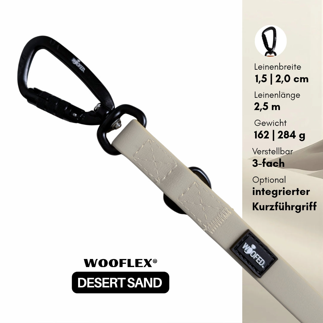 Nahaufnahme sandfarbener verstellbarer Führleine mit schwarzem Twist-Lock-Karabiner, sichtbaren Nähten und Logo-Patch