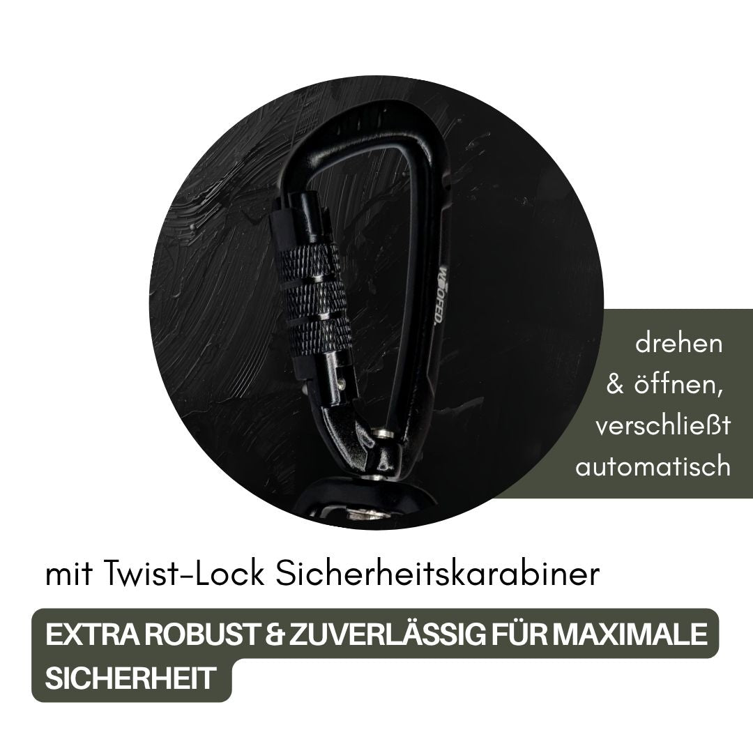 Nahaufnahme schwarzer Twist-Lock-Karabiner mit geriffeltem Drehverschluss auf dunklem, texturiertem Hintergrund